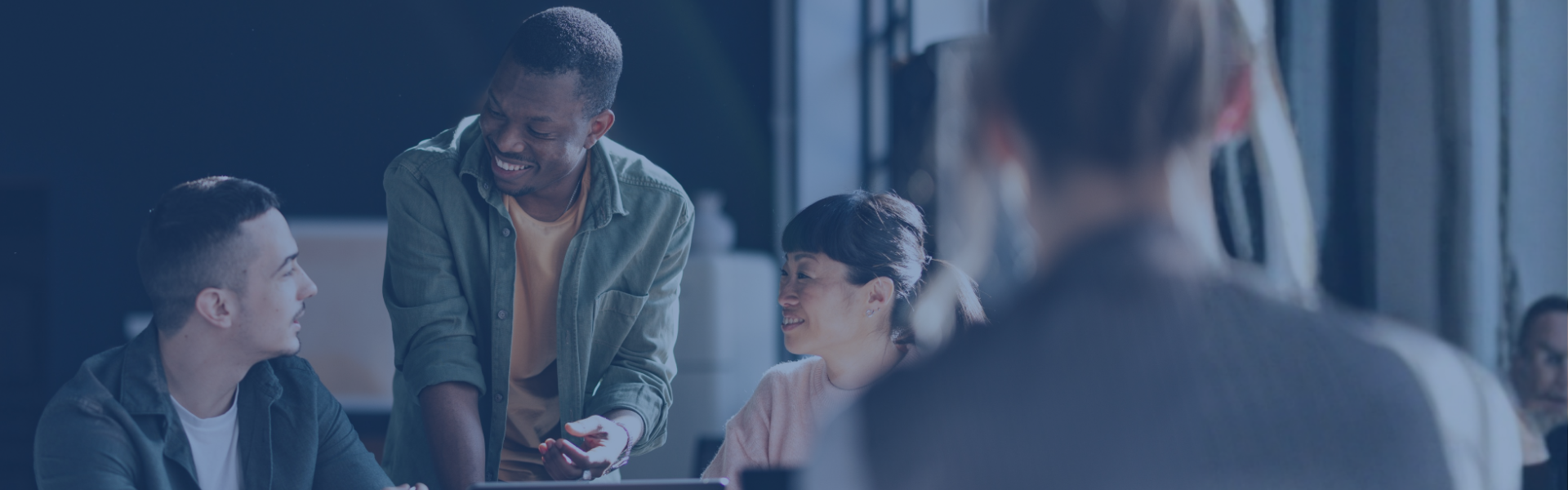 Three students sitting together in a library