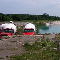 Cement mixers by gravel pit