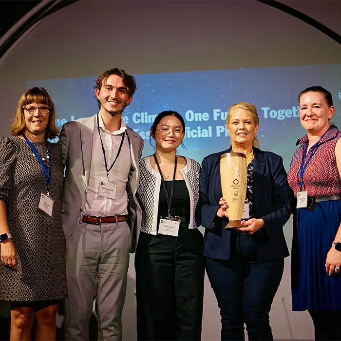 Students on stage receiving their award