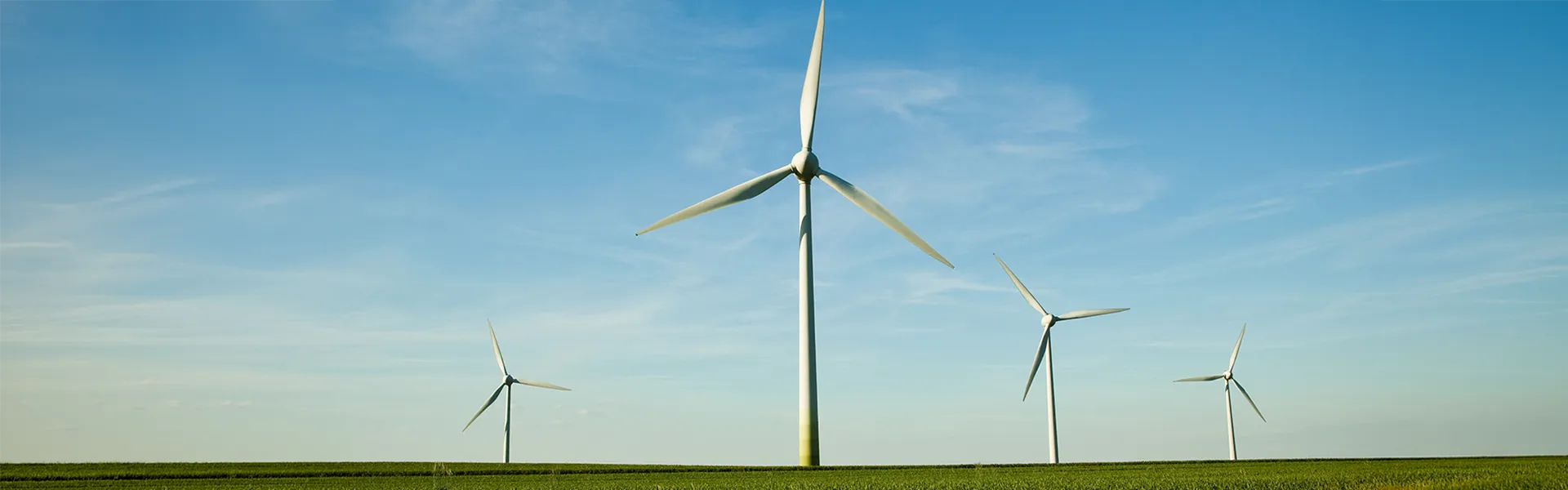 4 windmills in a farmer's field