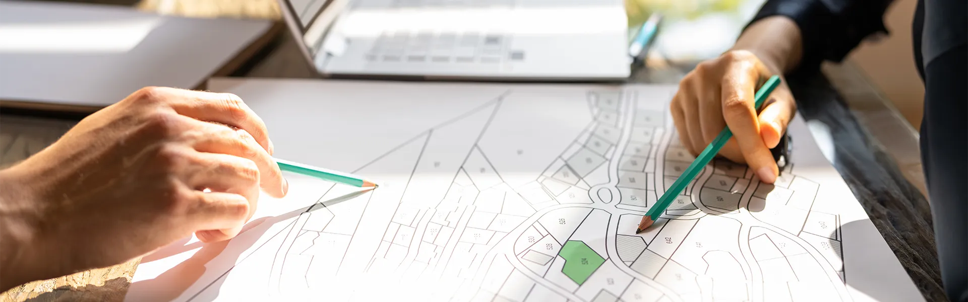 Planners reviewing a plan on a table