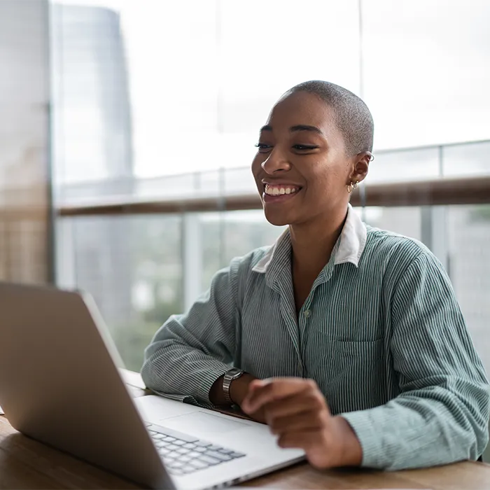 Lady at a laptop smiling