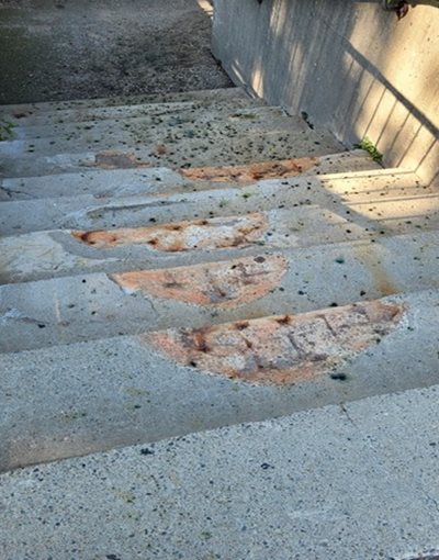 Steps leading to resting area, with no ramp